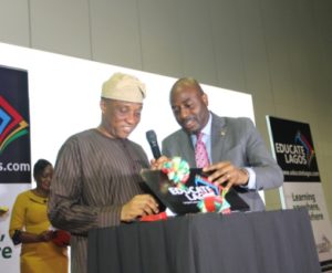 The Representative of the Governor and Secretary to the State Government, Mr. Tunji Bello logging in to the website. www.educate lagos.com to formally launch the Lagos State Digital Library while being assisted by the Special Adviser on Education, Mr. Obafela Bank- Olemoh at the formal unveiling of the Lagos Digital Library held at Landmark Events Centre, Oniru Estate on Friday, April 28, 2017.